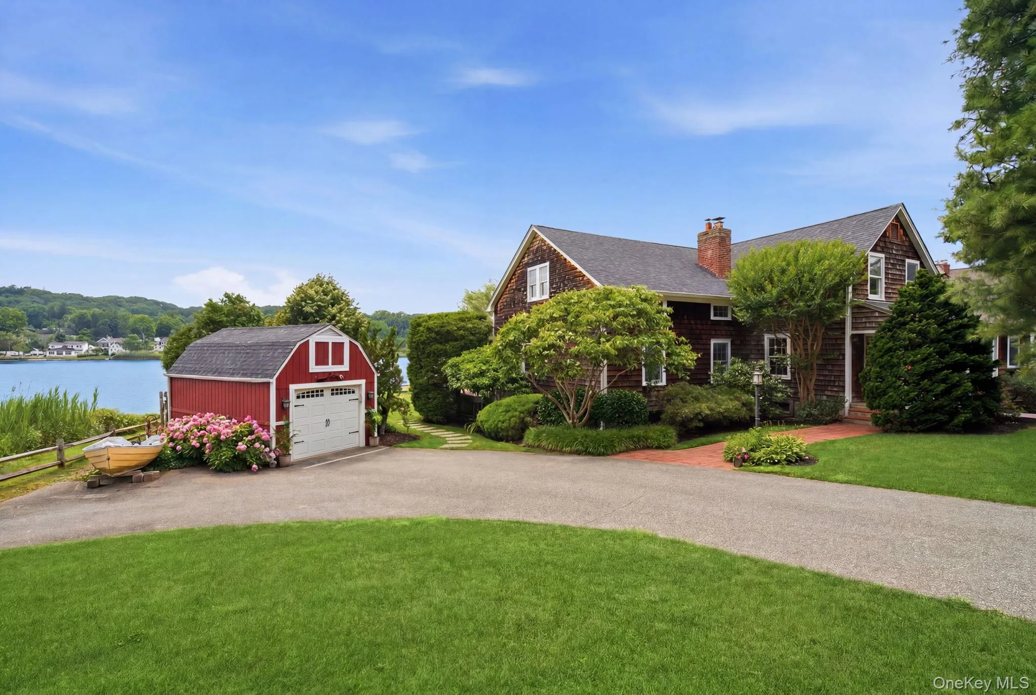 Driveway with ample parking and 1-car garage. Driveway with ample parking and 1-car garage.