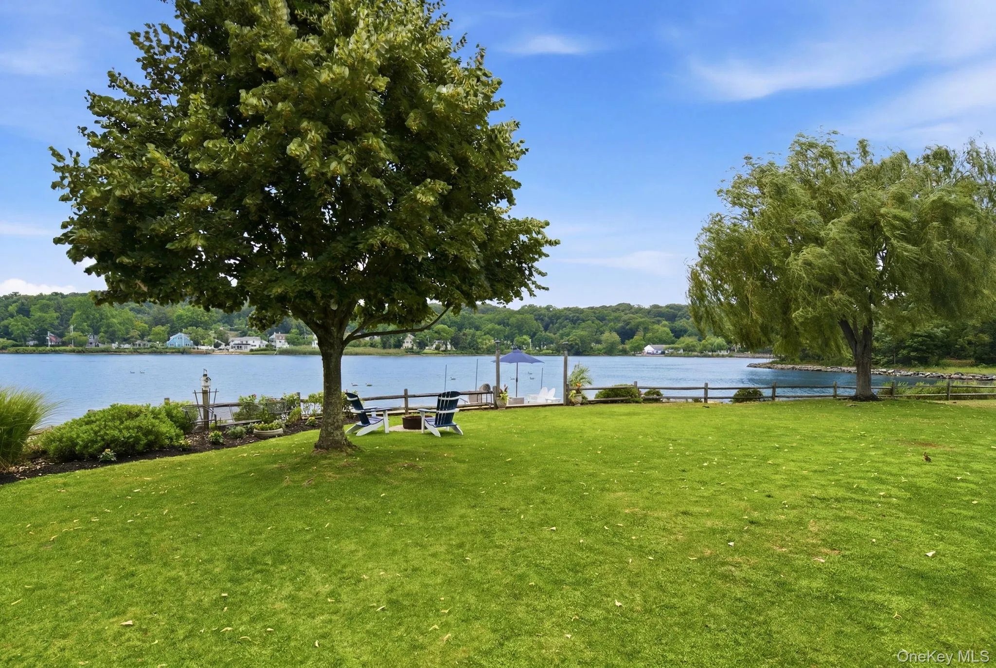 Sprawling lawn with stunning pond views. Sprawling lawn with stunning pond views.