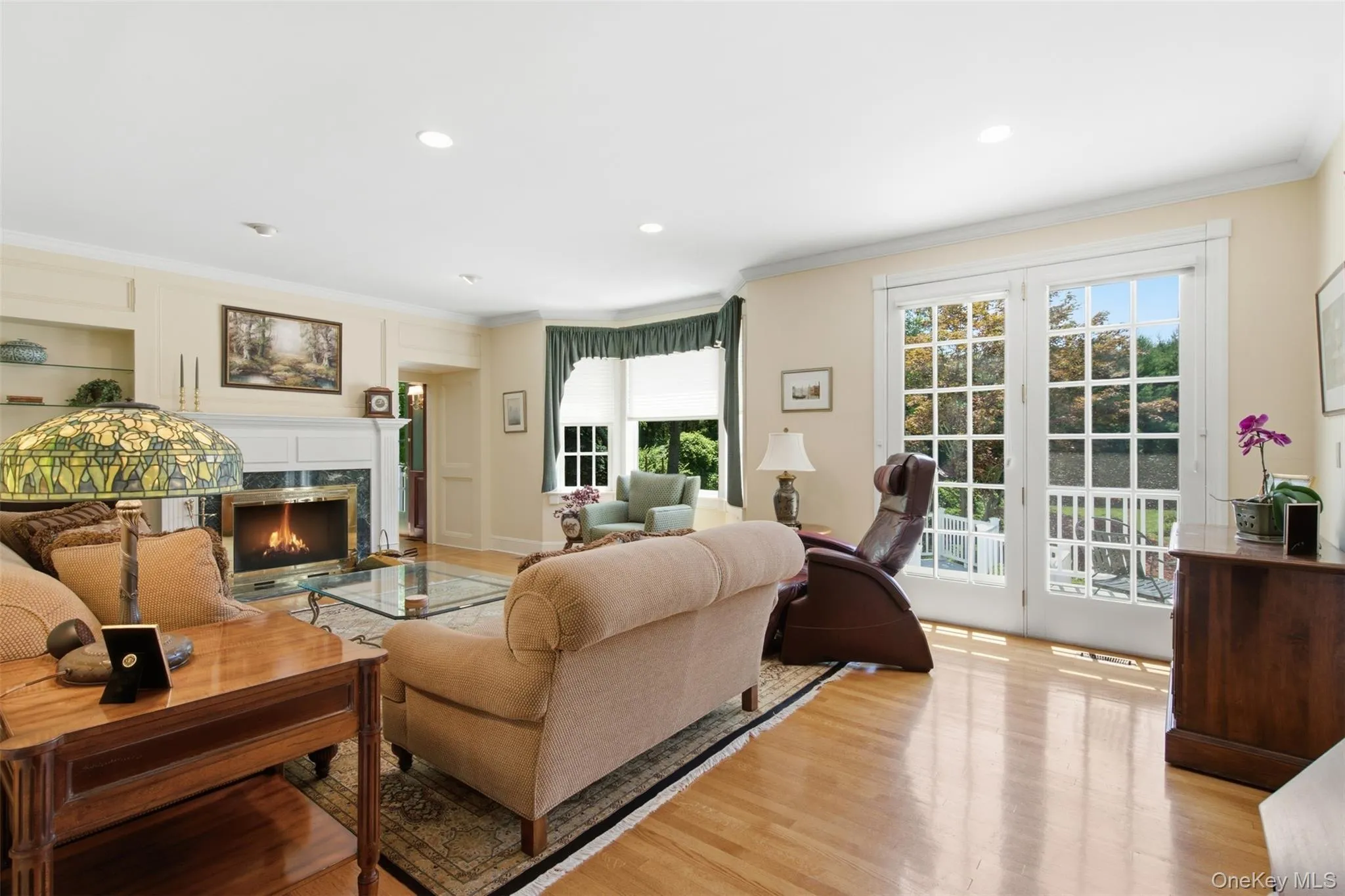 Family room with french doors leading out to the deck. Family room with french doors leading out to the deck.