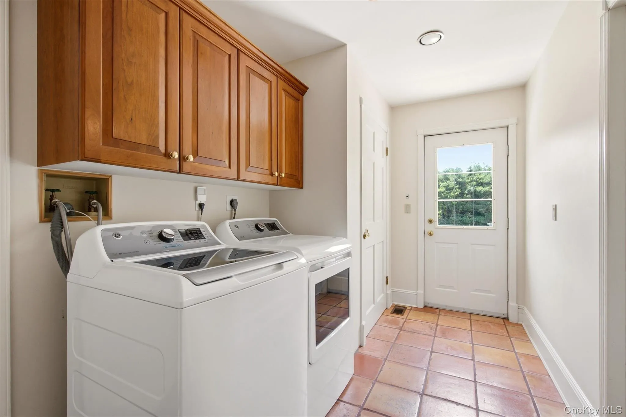 Separate laundry area with access to backyard, 2 car garage and first floor bedroom Separate laundry area with access to backyard, 2 car garage and first floor bedroom