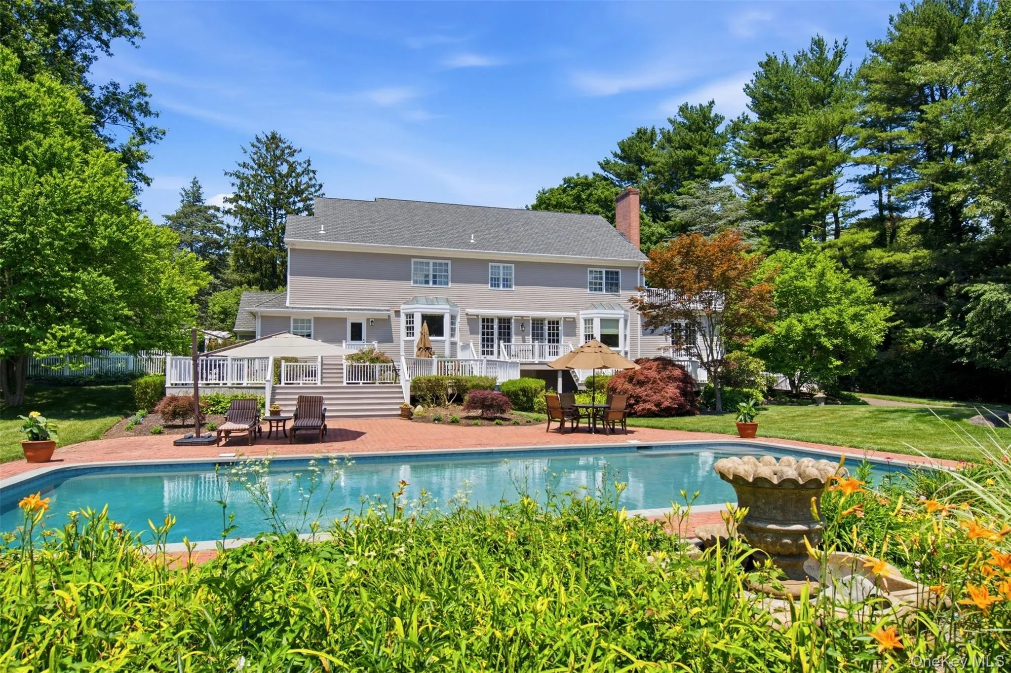 Beautiful Perennial gardens frame the pool Beautiful Perennial gardens frame the pool