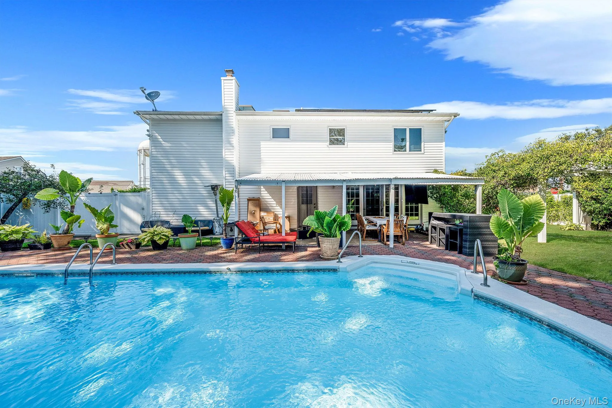 View of swimming pool featuring a patio View of swimming pool featuring a patio