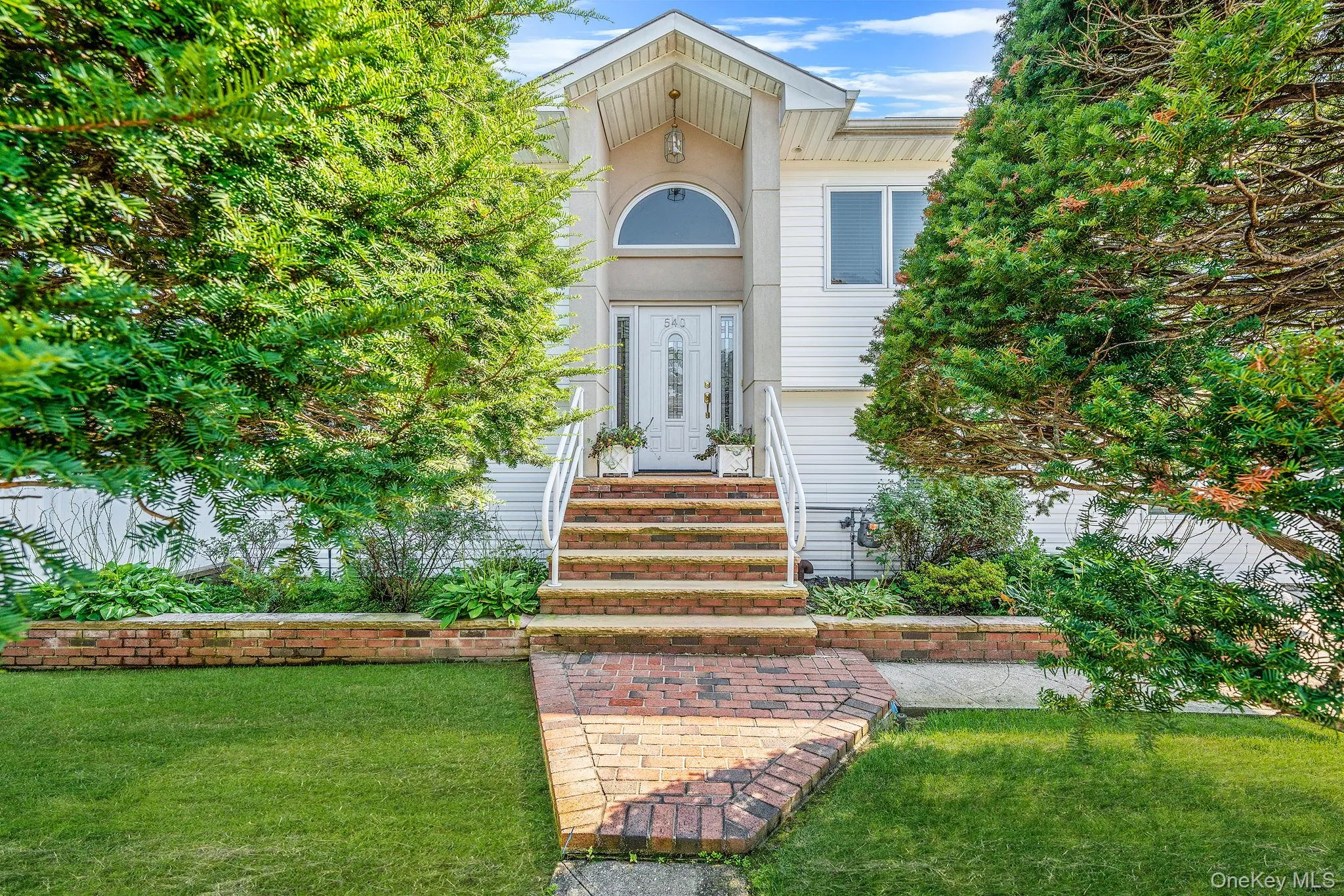 Property entrance featuring a yard Property entrance featuring a yard