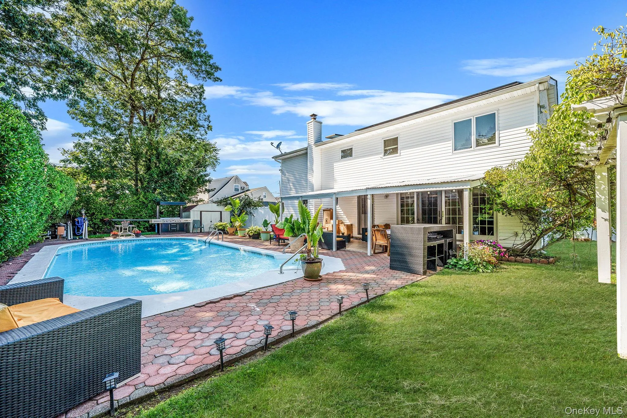 View of swimming pool featuring a patio area and outdoor lounge area View of swimming pool featuring a patio area and outdoor lounge area