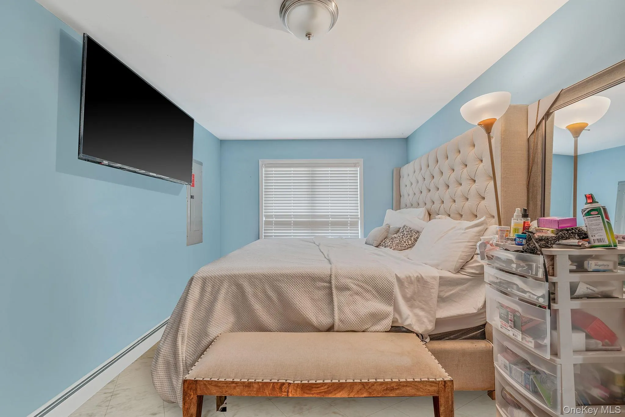 Bedroom with a baseboard heating unit and baseboards Bedroom with a baseboard heating unit and baseboards