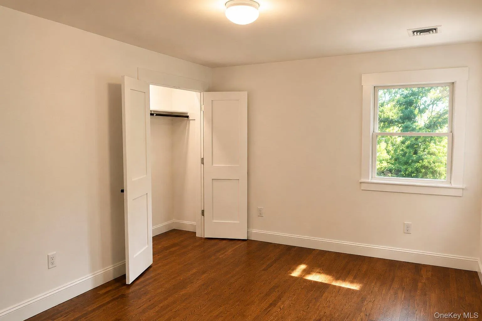 Master bedroom with large illuminated closet Master bedroom with large illuminated closet
