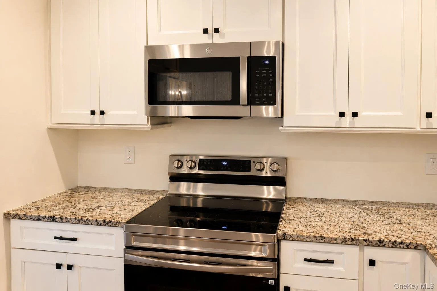 Brand new kitchen featuring new countertops, cabinets, and stainless steel appliances Brand new kitchen featuring new countertops, cabinets, and stainless steel appliances