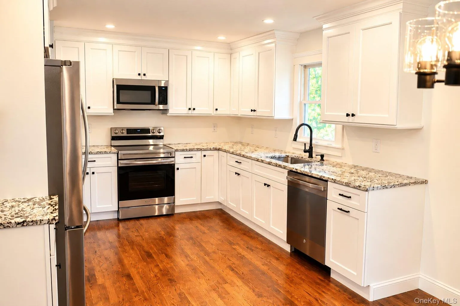 Brand new kitchen featuring new stainless steel appliances Brand new kitchen featuring new stainless steel appliances