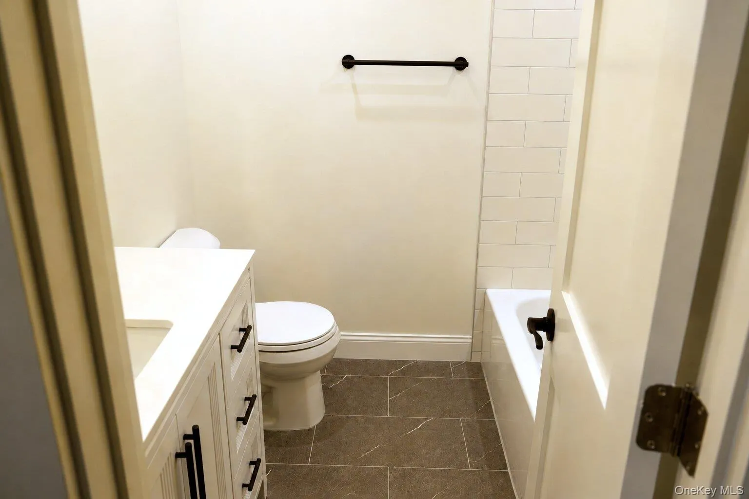 Full main bathroom with new fixtures and tile Full main bathroom with new fixtures and tile