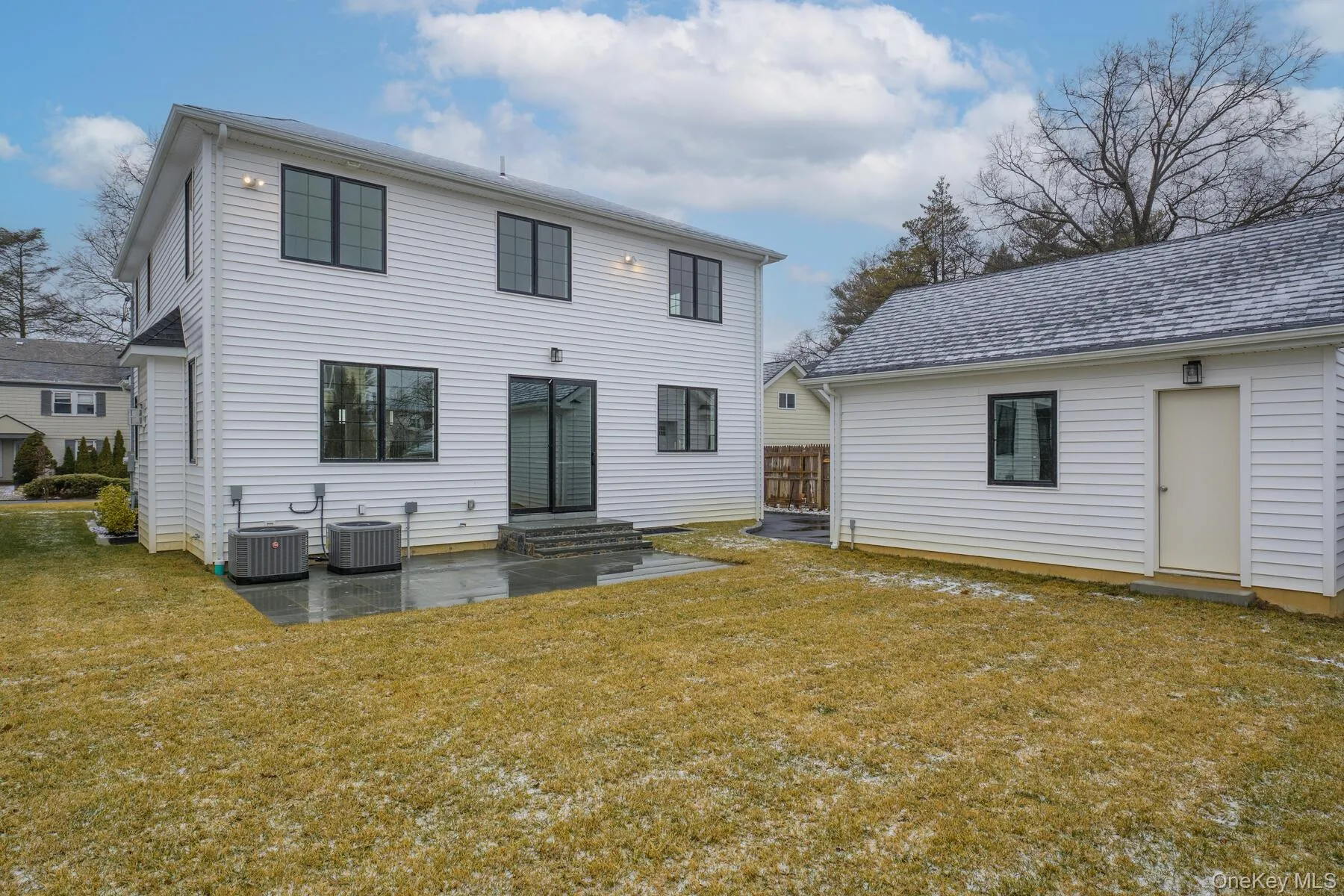 Rear view of property featuring a yard, central AC unit, and a patio area Rear view of property featuring a yard, central AC unit, and a patio area