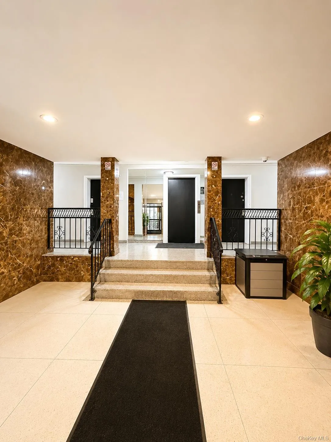lobby entrance with staircase to elevator lobby entrance with staircase to elevator