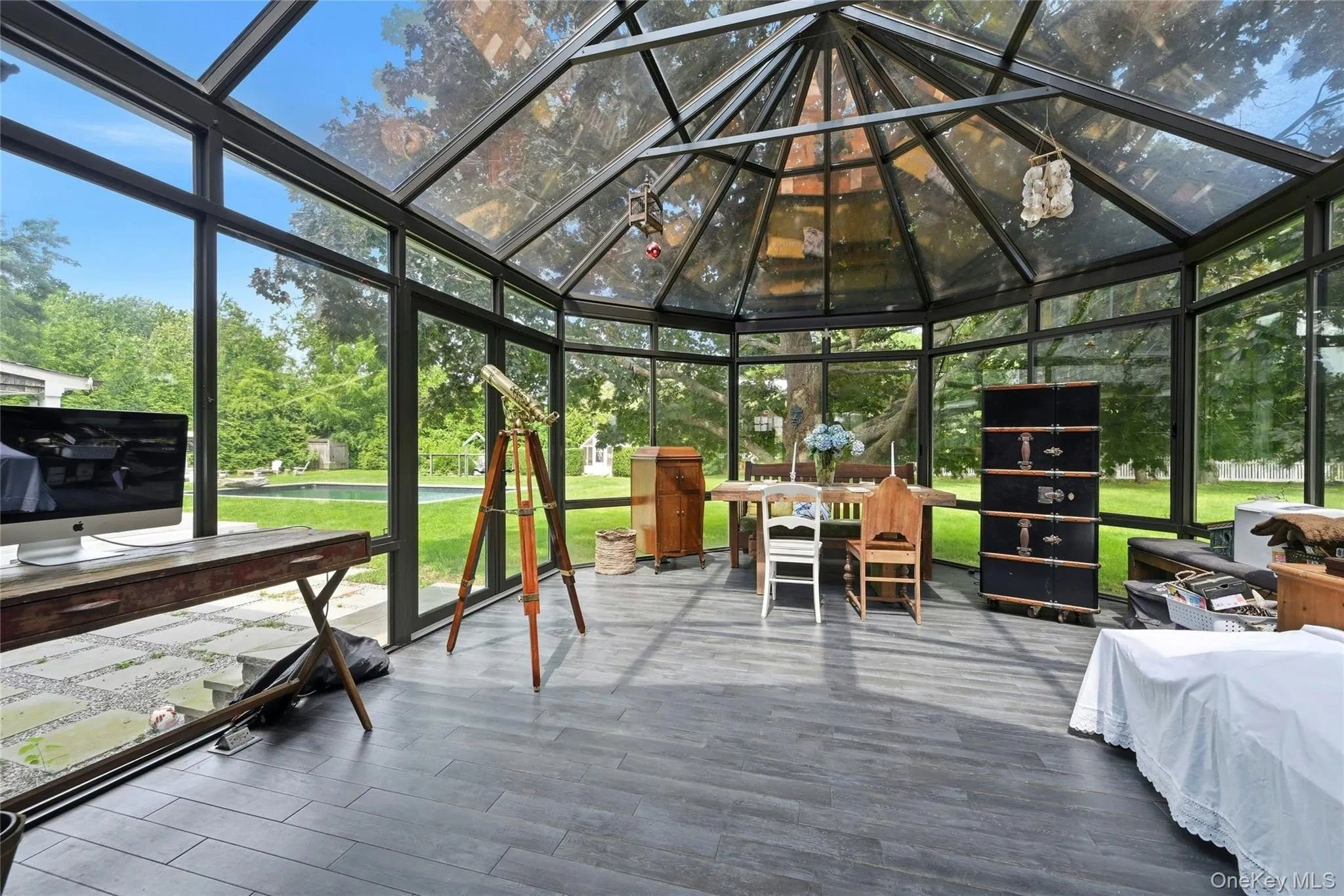 Beautiful sun-room addition, utilized as dining space as well as work space and star-gazing, with unobstructed view of spectacular back-yard Beautiful sun-room addition, utilized as dining space as well as work space and star-gazing, with unobstructed view of spectacular back-yard