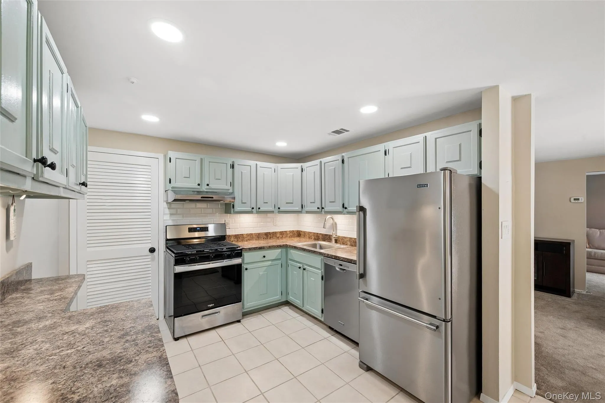 Tile floor, stainless steel appliances, newly painted cabinets Tile floor, stainless steel appliances, newly painted cabinets