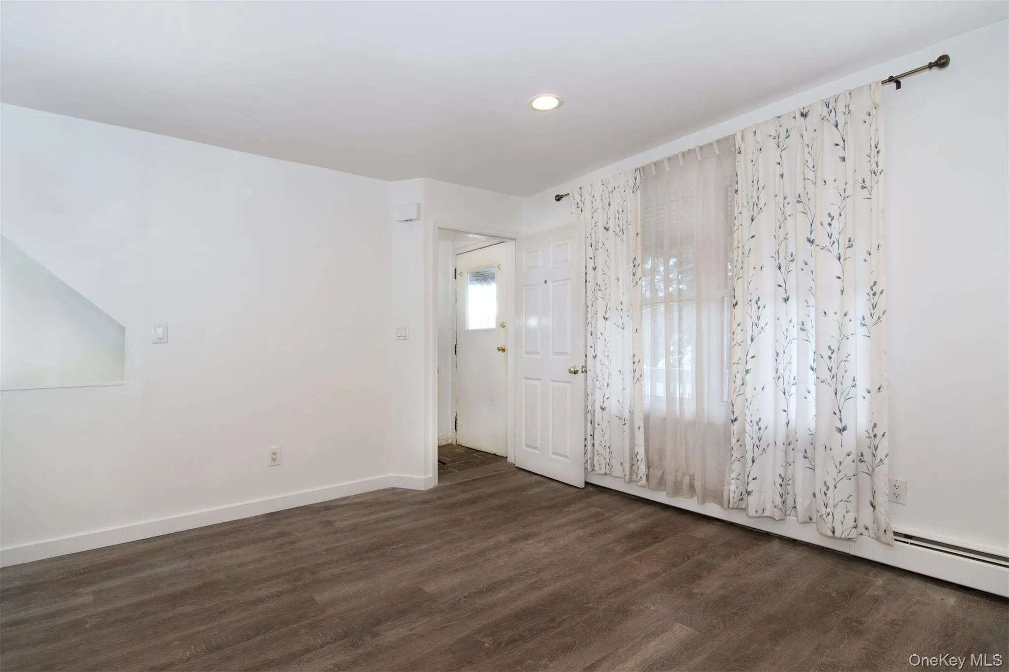 Entry with dark hardwood / wood-style floors Entry with dark hardwood / wood-style floors