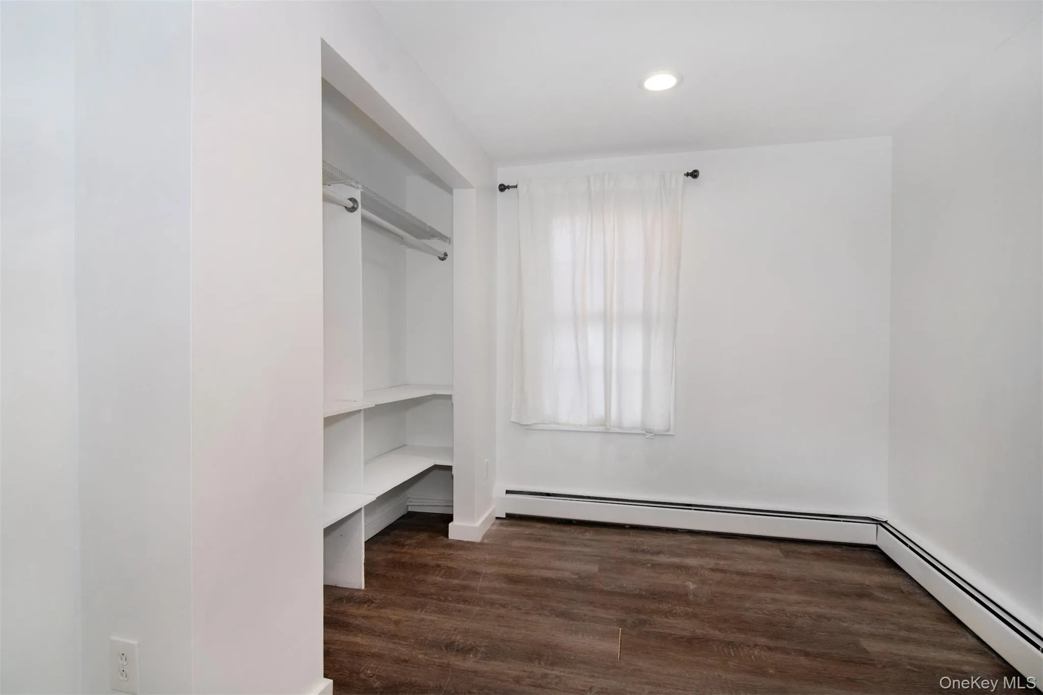 Bedroom View 1and dark hardwood / wood-style flooring Bedroom View 1and dark hardwood / wood-style flooring