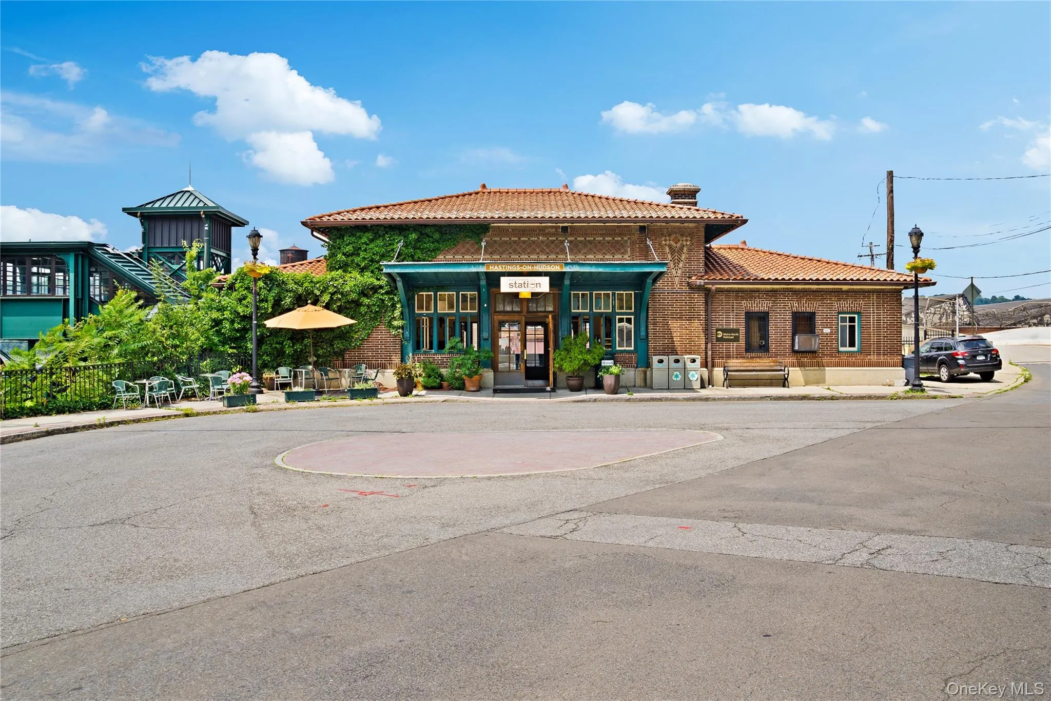 View of building exterior featuring uncovered parking View of building exterior featuring uncovered parking
