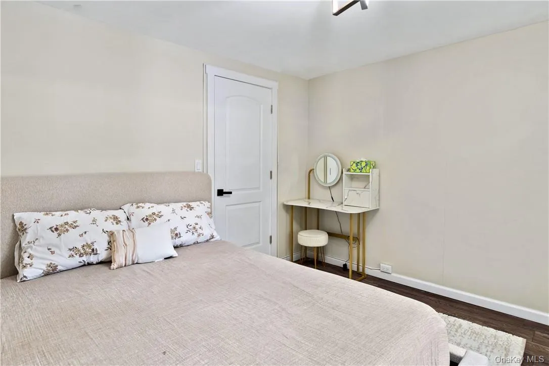 2nd bedroom featuring dark hardwood / wood-style flooring 2nd bedroom featuring dark hardwood / wood-style flooring