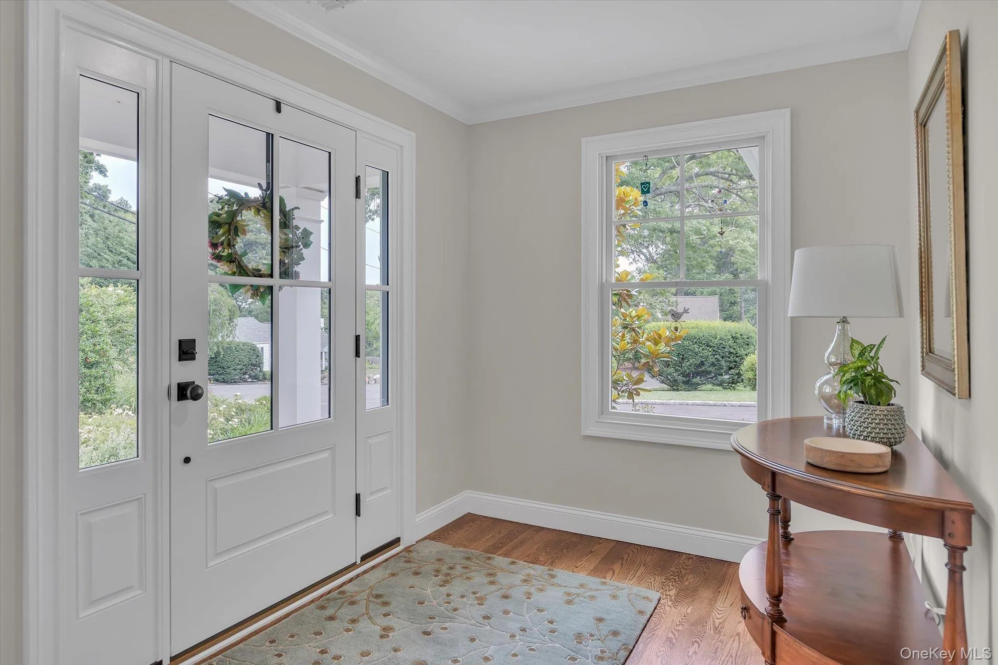 Entry Foyer with Red Oak Floors and Large Coat Closet Entry Foyer with Red Oak Floors and Large Coat Closet