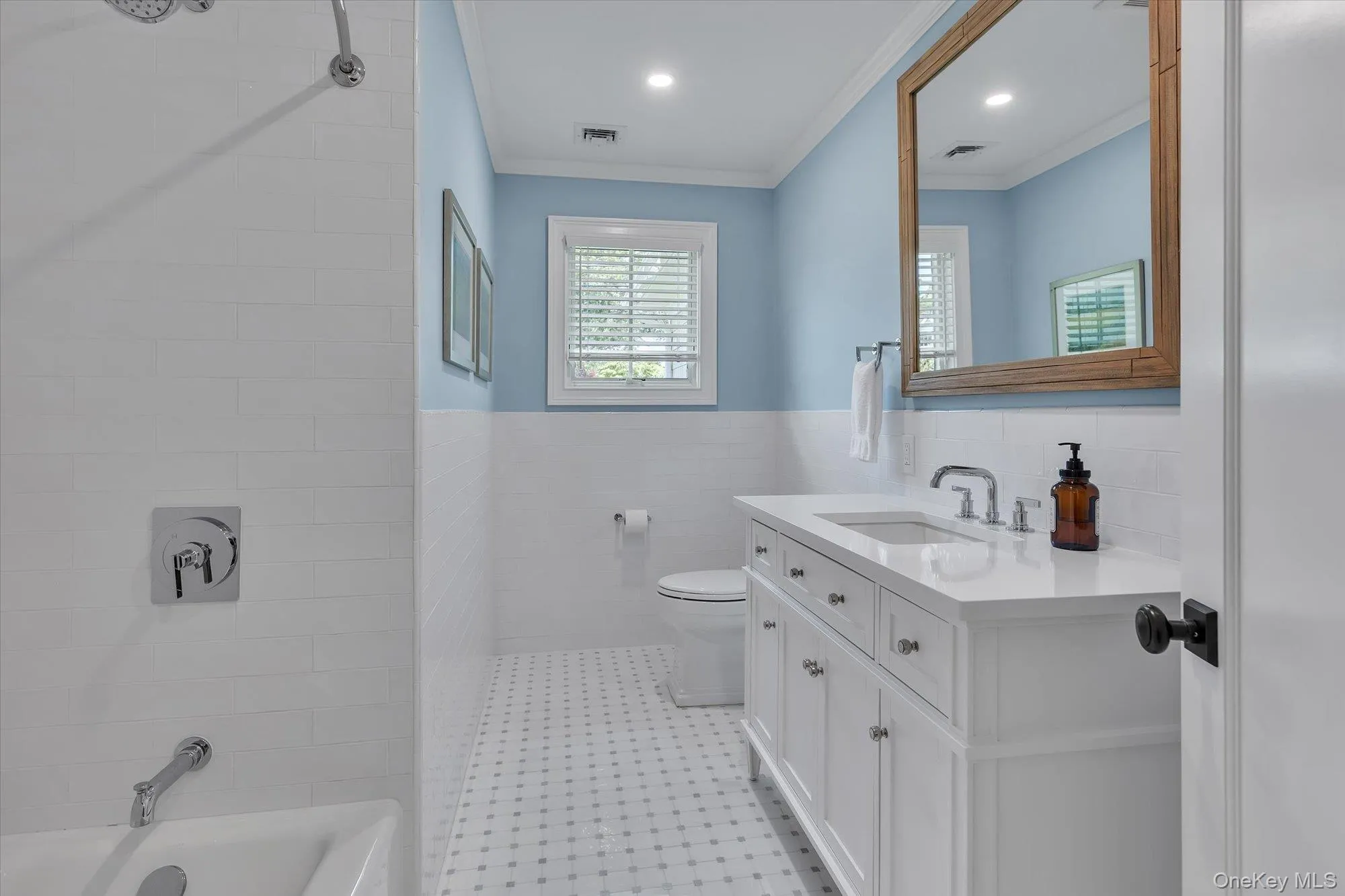 Well Appointed Hall Bath with Tub/Shower Combo & Marble Basket Weave Floor. Well Appointed Hall Bath with Tub/Shower Combo & Marble Basket Weave Floor.