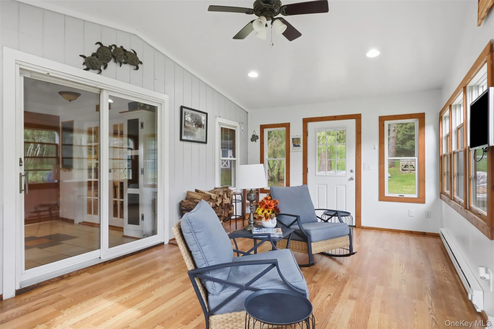 Heated 4 season room adds additional living space and can also act as a mudroom. Electric heat. Heated 4 season room adds additional living space and can also act as a mudroom. Electric heat.