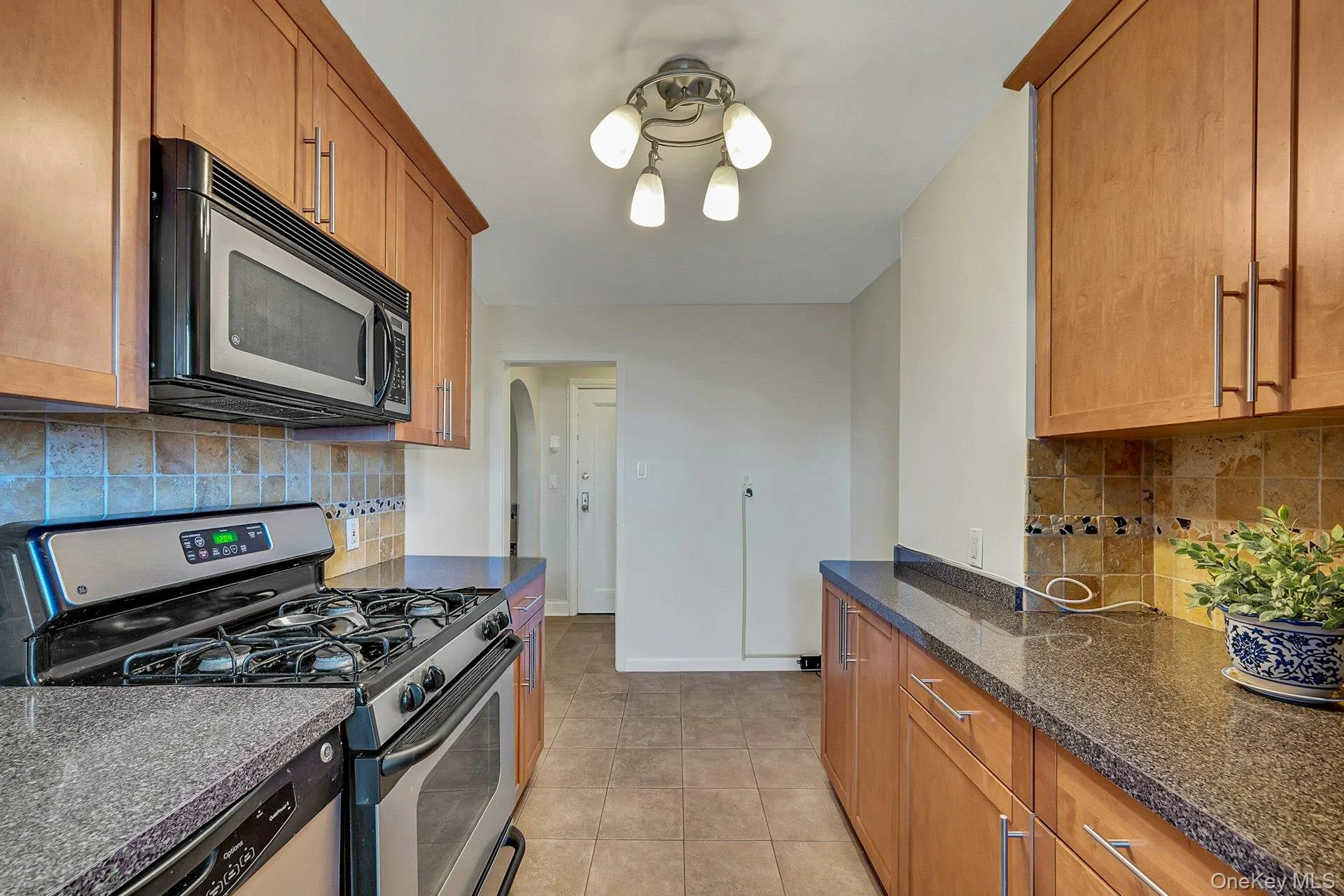 Eat in Kitchen with stainless steel appliances and back splash Eat in Kitchen with stainless steel appliances and back splash