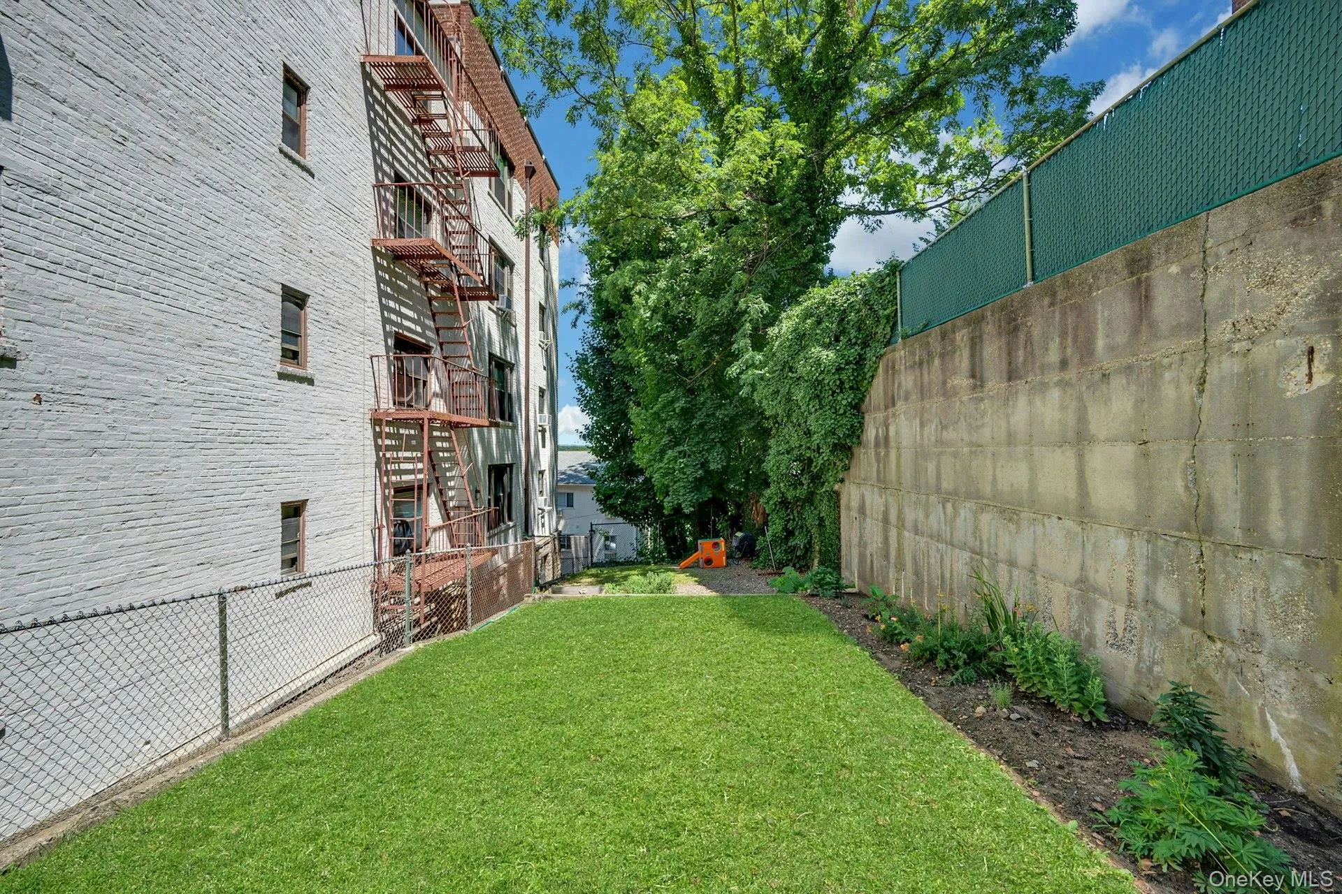 Yard with garden and grass area Yard with garden and grass area