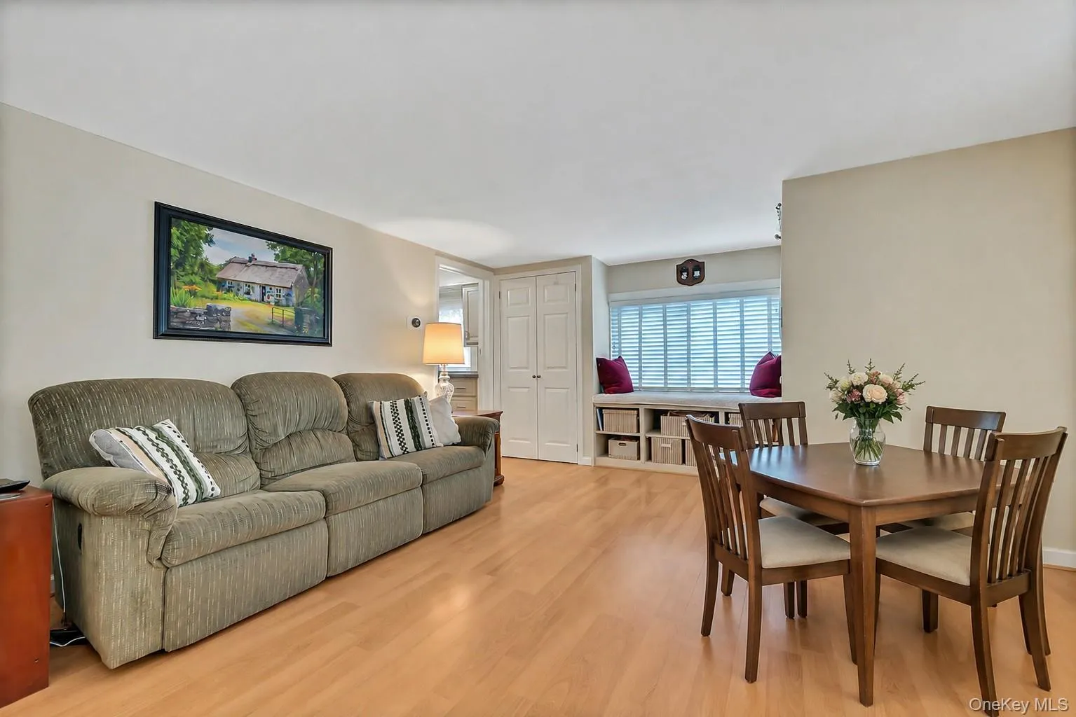 Living room with virtually staged dining area Living room with virtually staged dining area