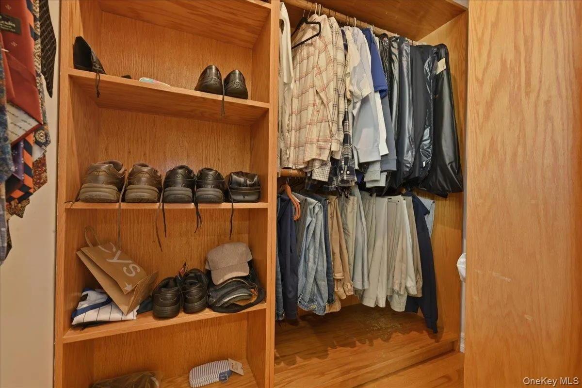 Walk in closets with custom storage Walk in closets with custom storage