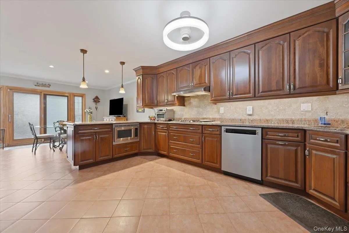 Large kitchen with custom cabinets and SS Thermador appliances Large kitchen with custom cabinets and SS Thermador appliances