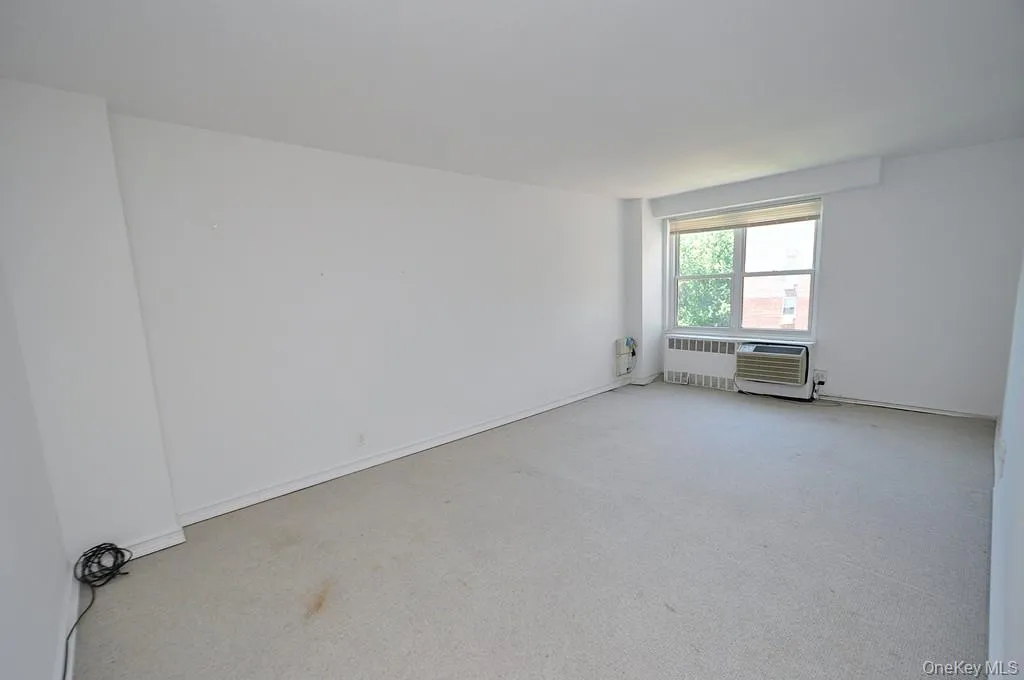 The living room has covered parquet floors, Western exposures. The living area is approx. 20'-11" x 11'-7" The living room has covered parquet floors, Western exposures. The living area is approx. 20'-11" x 11'-7"