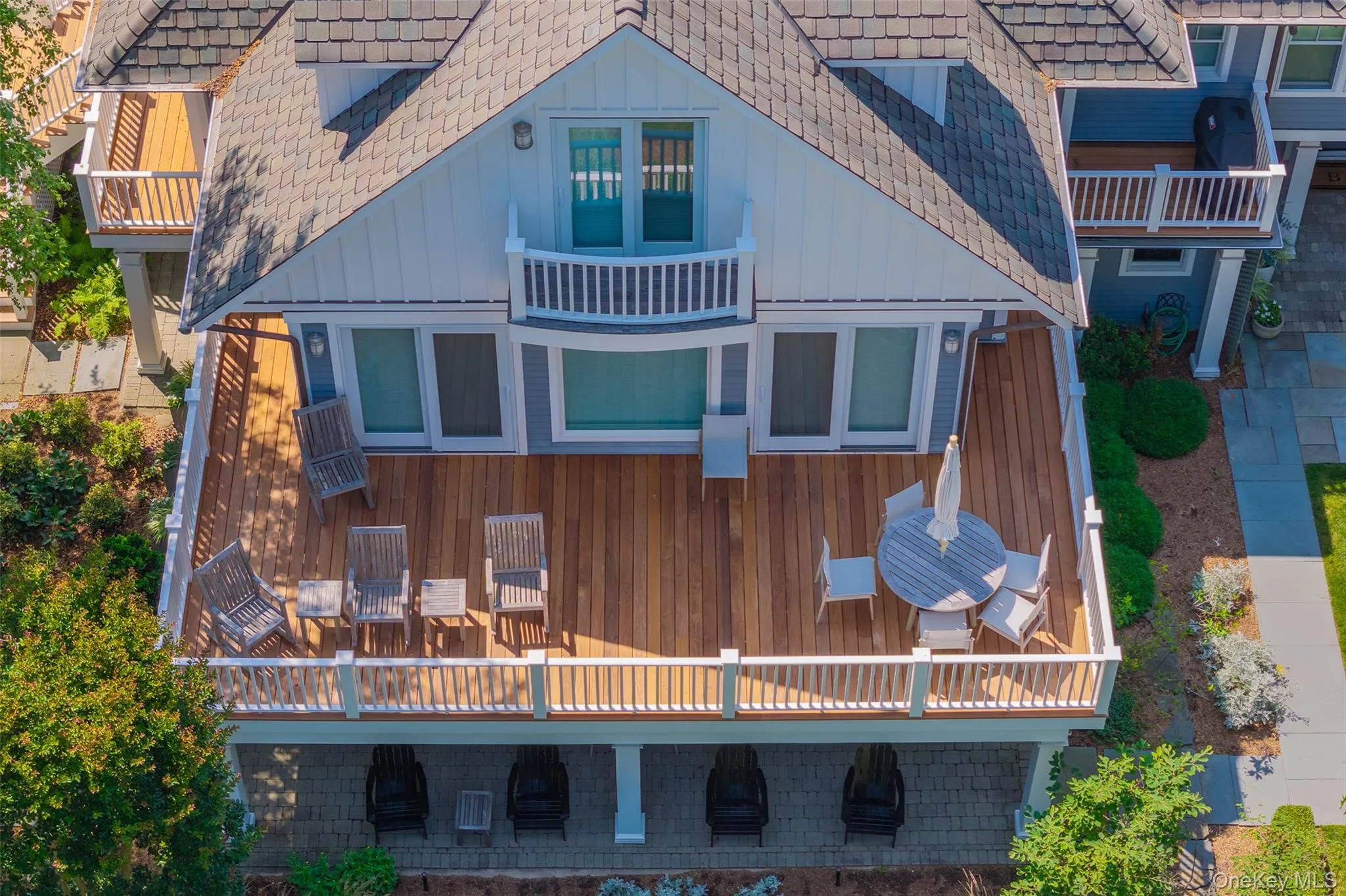 Deck off of primary ensuite overlooking Great South Bay and the "Peathole" Deck off of primary ensuite overlooking Great South Bay and the "Peathole"