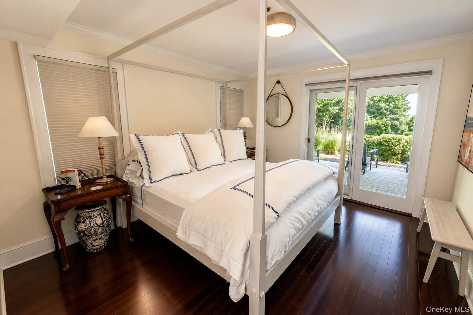 Dark wood-finish flooring with white baseboards throughout Dark wood-finish flooring with white baseboards throughout
