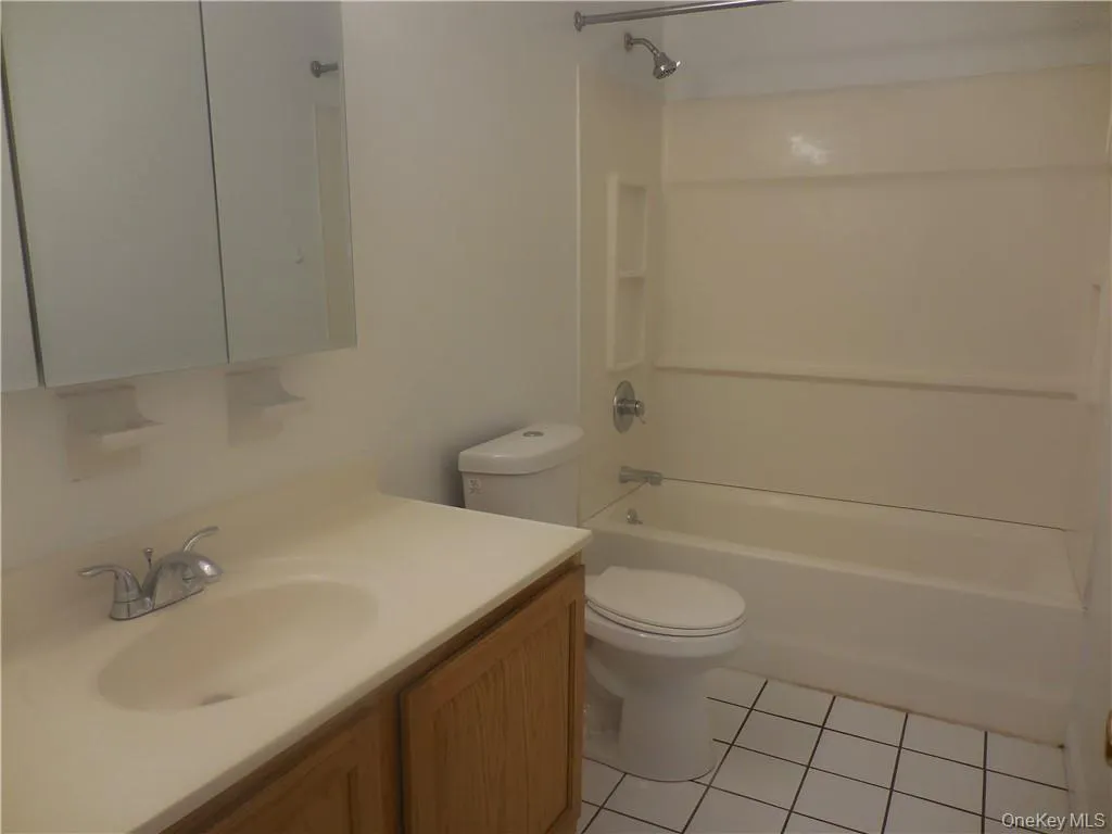 Full bathroom with a tub. Full bathroom with a tub.