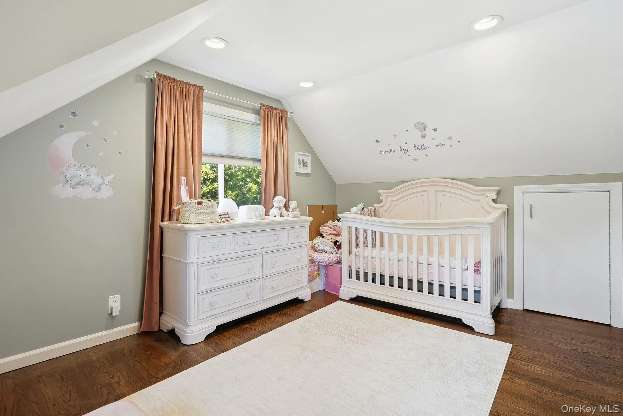 Room with wood-finish flooring, recessed lighting, and a window with blinds Room with wood-finish flooring, recessed lighting, and a window with blinds