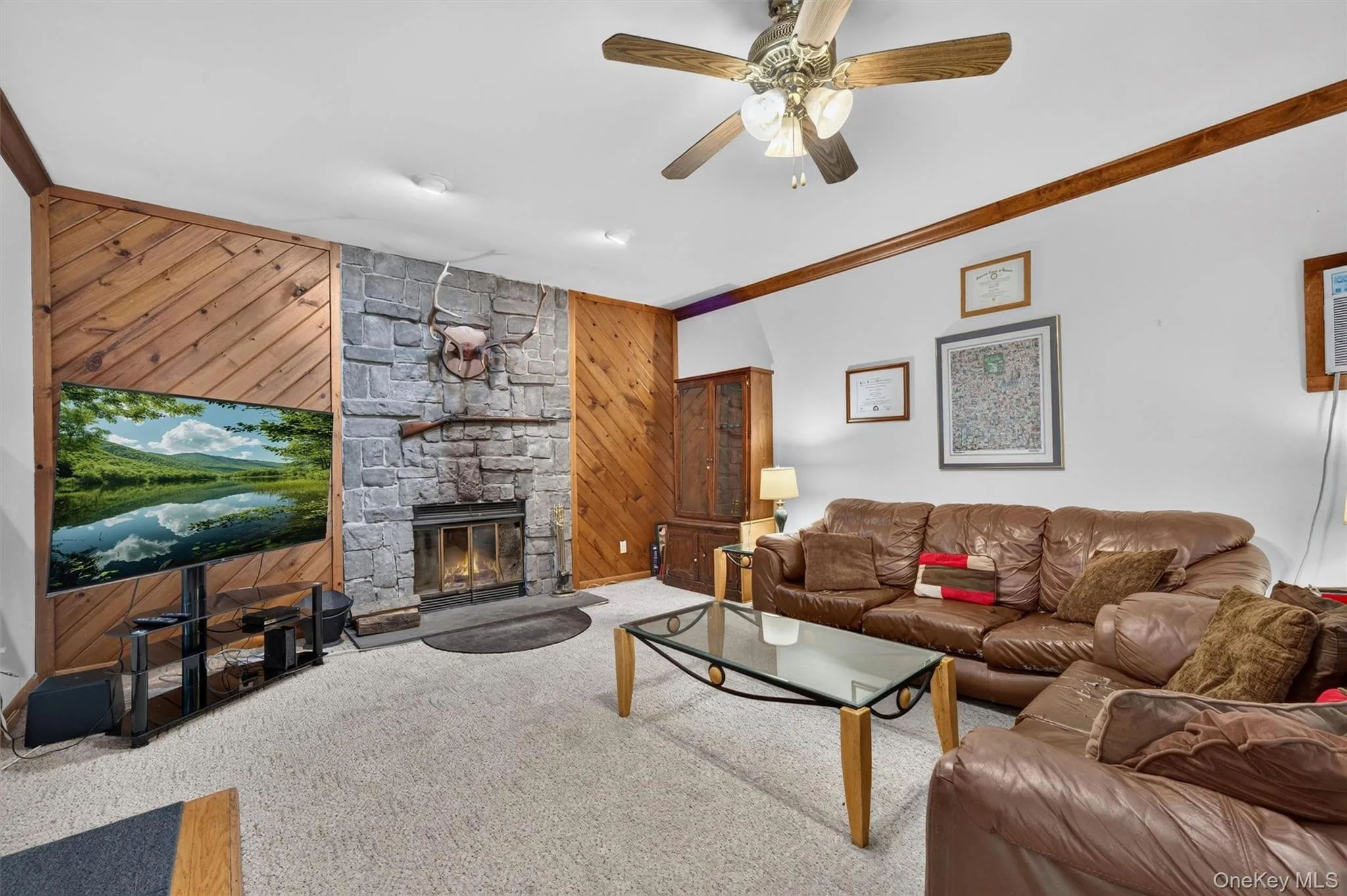The family room has floor to ceiling stone and the fireplace is wood burning. The family room has floor to ceiling stone and the fireplace is wood burning.