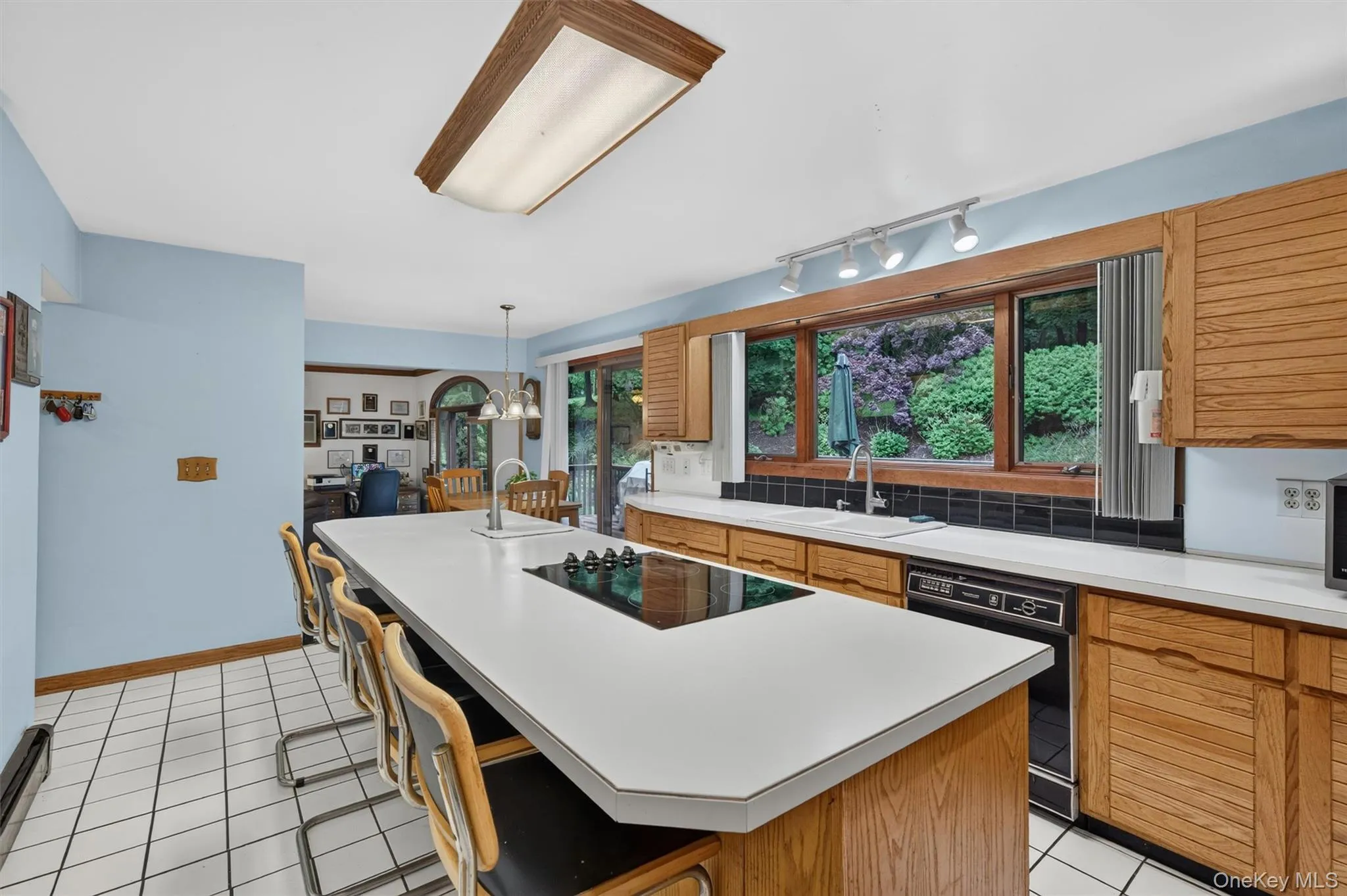 The oversized island can easily fit four stools. The oversized island can easily fit four stools.