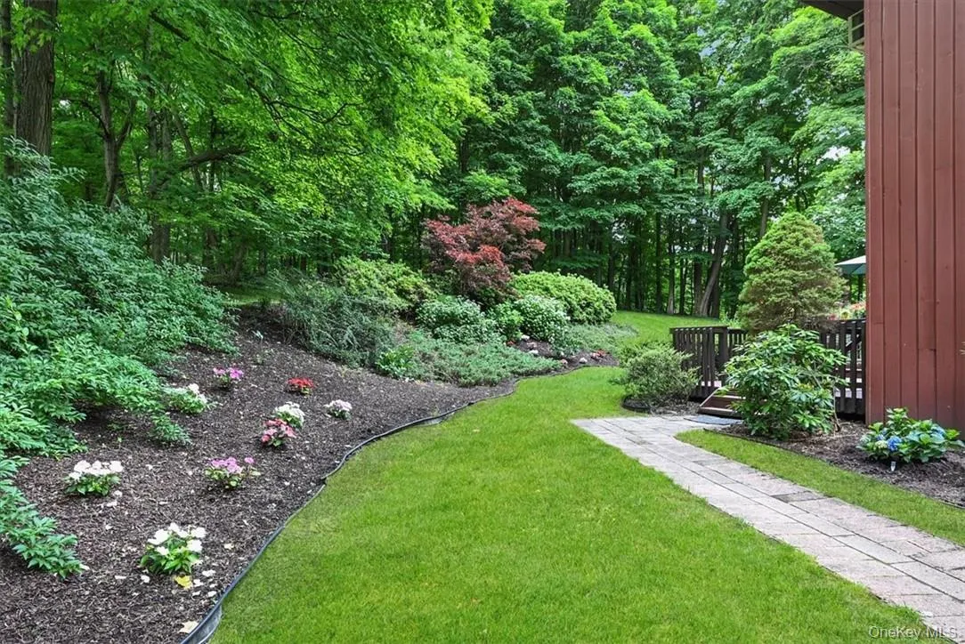 This home shows off Mother Nature at her very best! The side yard is as pretty as the front and the back! This home shows off Mother Nature at her very best! The side yard is as pretty as the front and the back!