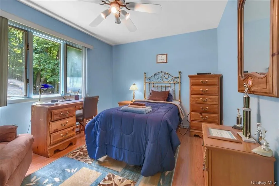 This bedroom has a view of the beautiful back yard through three windows! This bedroom has a view of the beautiful back yard through three windows!
