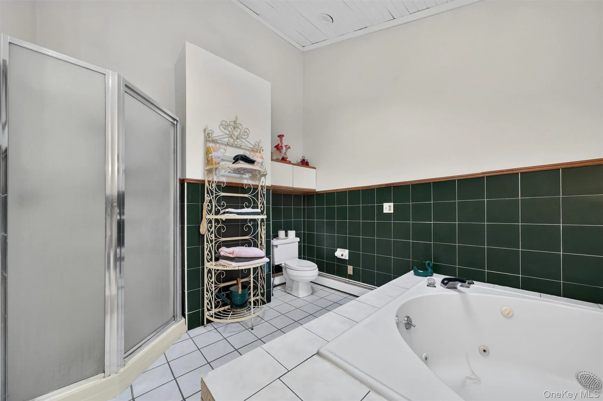 There is a huge tub and a separate shower. There is a huge tub and a separate shower.