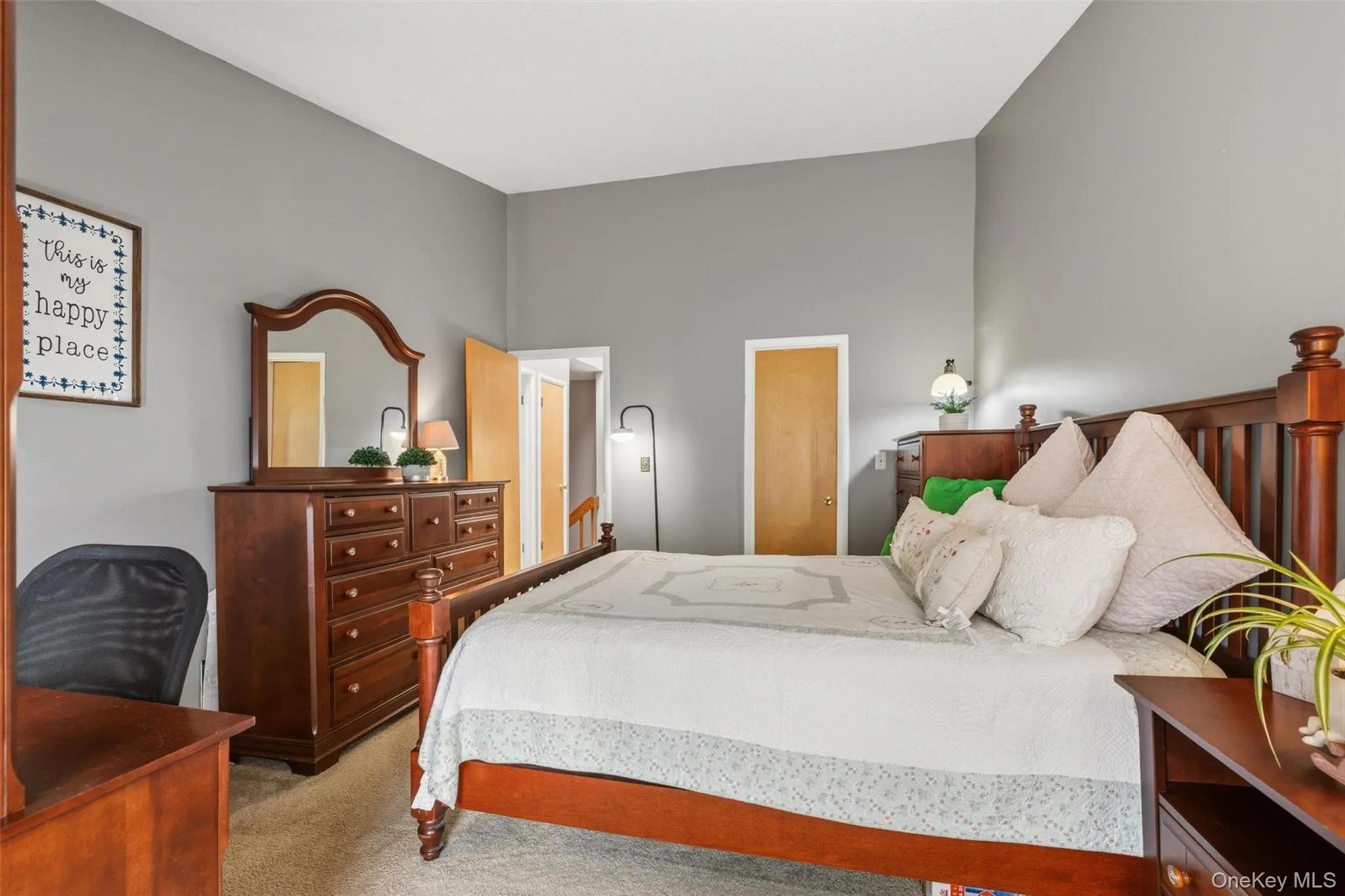 Bedroom with high ceilings, and a large walk-in custom closet Bedroom with high ceilings, and a large walk-in custom closet