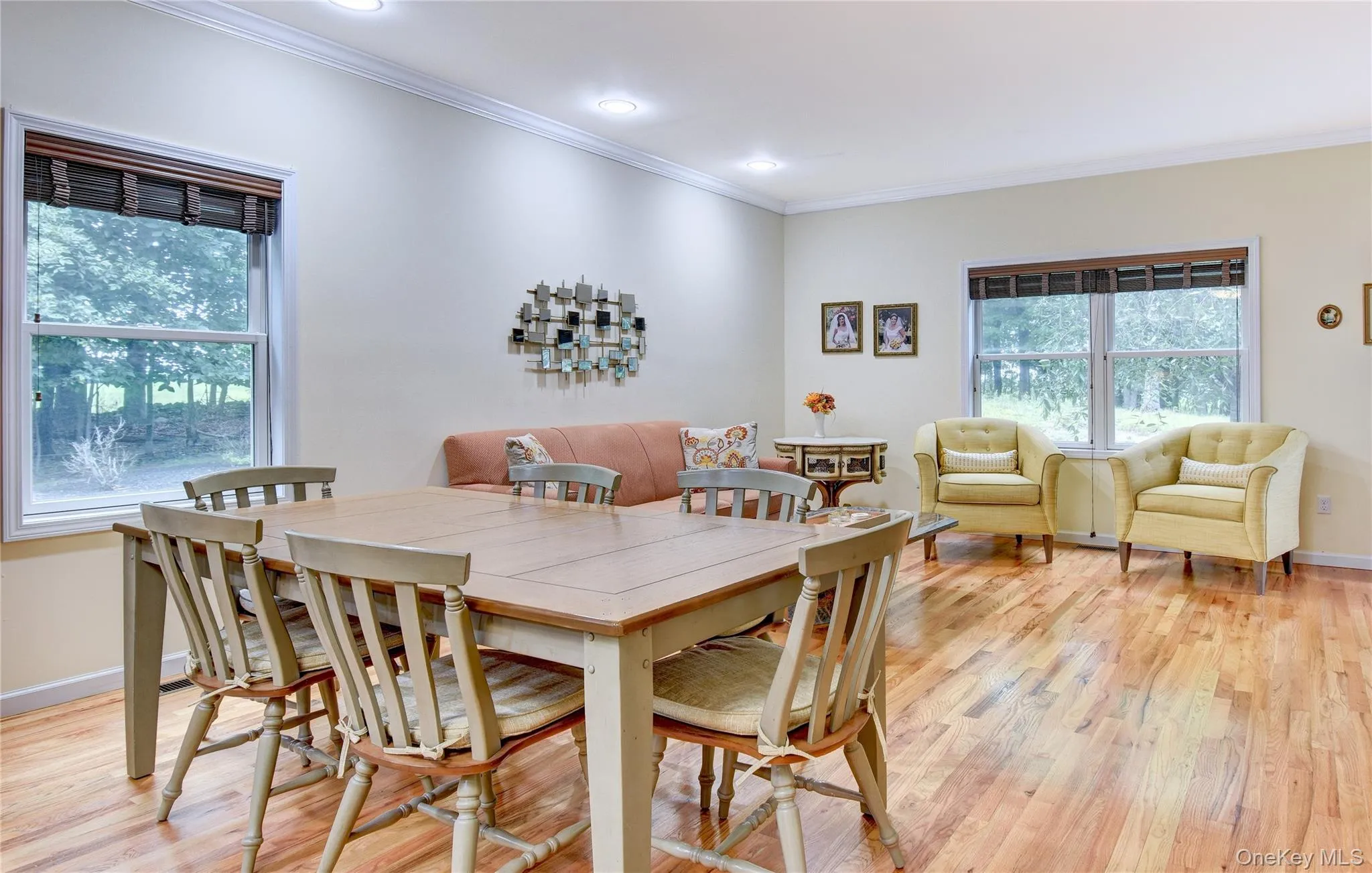 Legal accessory apartment: Open-concept living area featuring wood flooring, recessed lighting, and crown molding Legal accessory apartment: Open-concept living area featuring wood flooring, recessed lighting, and crown molding