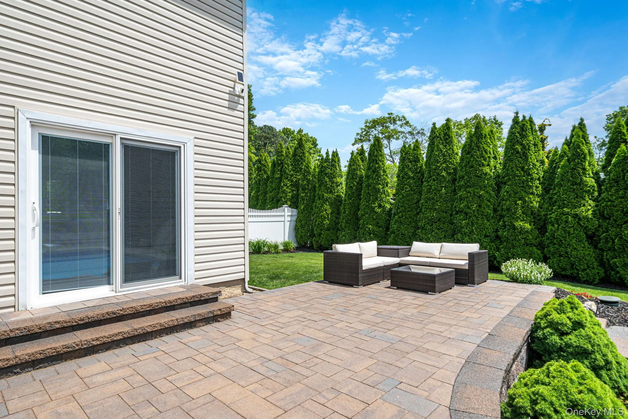 Pella slider to enter to and from the backyard oasis. Multiple seating areas/levels Pella slider to enter to and from the backyard oasis. Multiple seating areas/levels