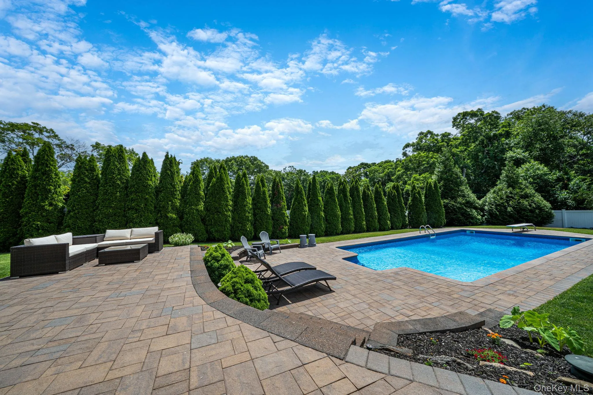 Expansive paver patio, with multiple seating areas, perfect to lounge in the sun. Tranquil setting Expansive paver patio, with multiple seating areas, perfect to lounge in the sun. Tranquil setting