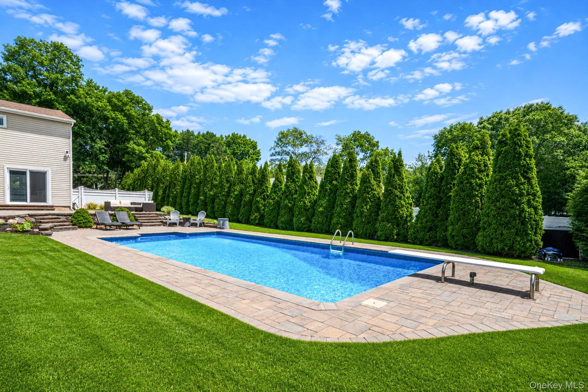 Double tiered seating areas over looking the pool. Mature landscaping and privacy throughout Double tiered seating areas over looking the pool. Mature landscaping and privacy throughout