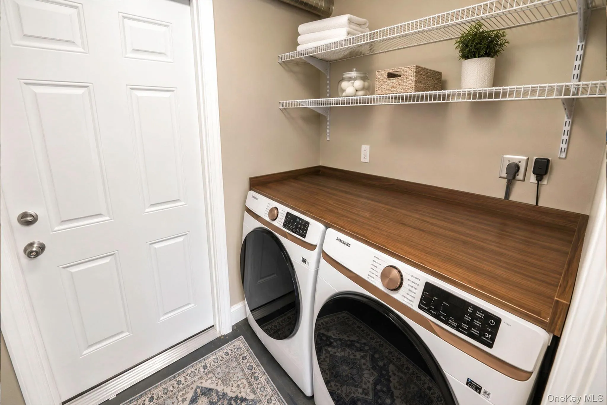Laundry area, Samsung front-loading washer and dryer Laundry area, Samsung front-loading washer and dryer