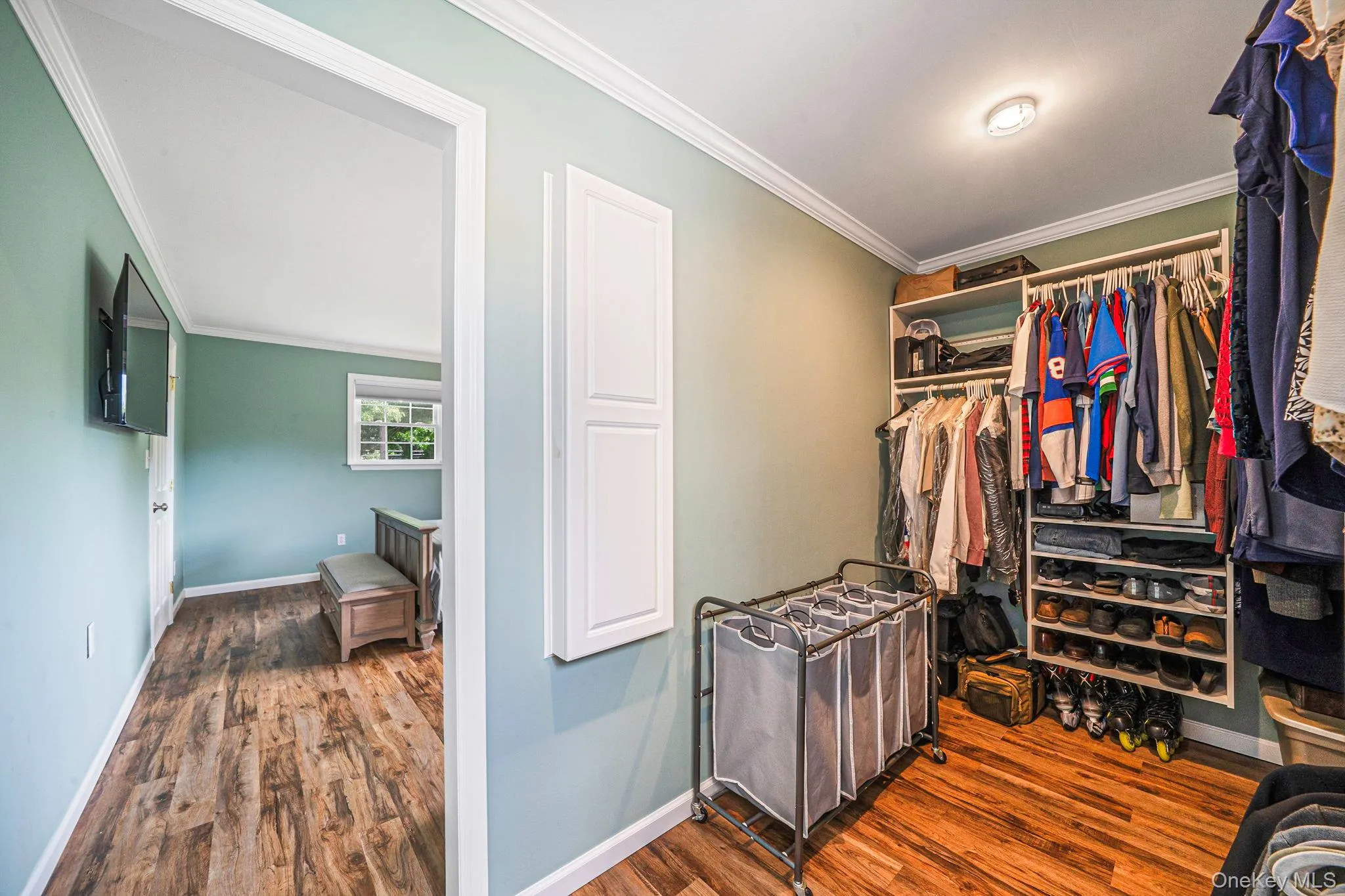 Walk-in closet featuring fold out ironing board. Bright and airy. Plenty of storage! Walk-in closet featuring fold out ironing board. Bright and airy. Plenty of storage!