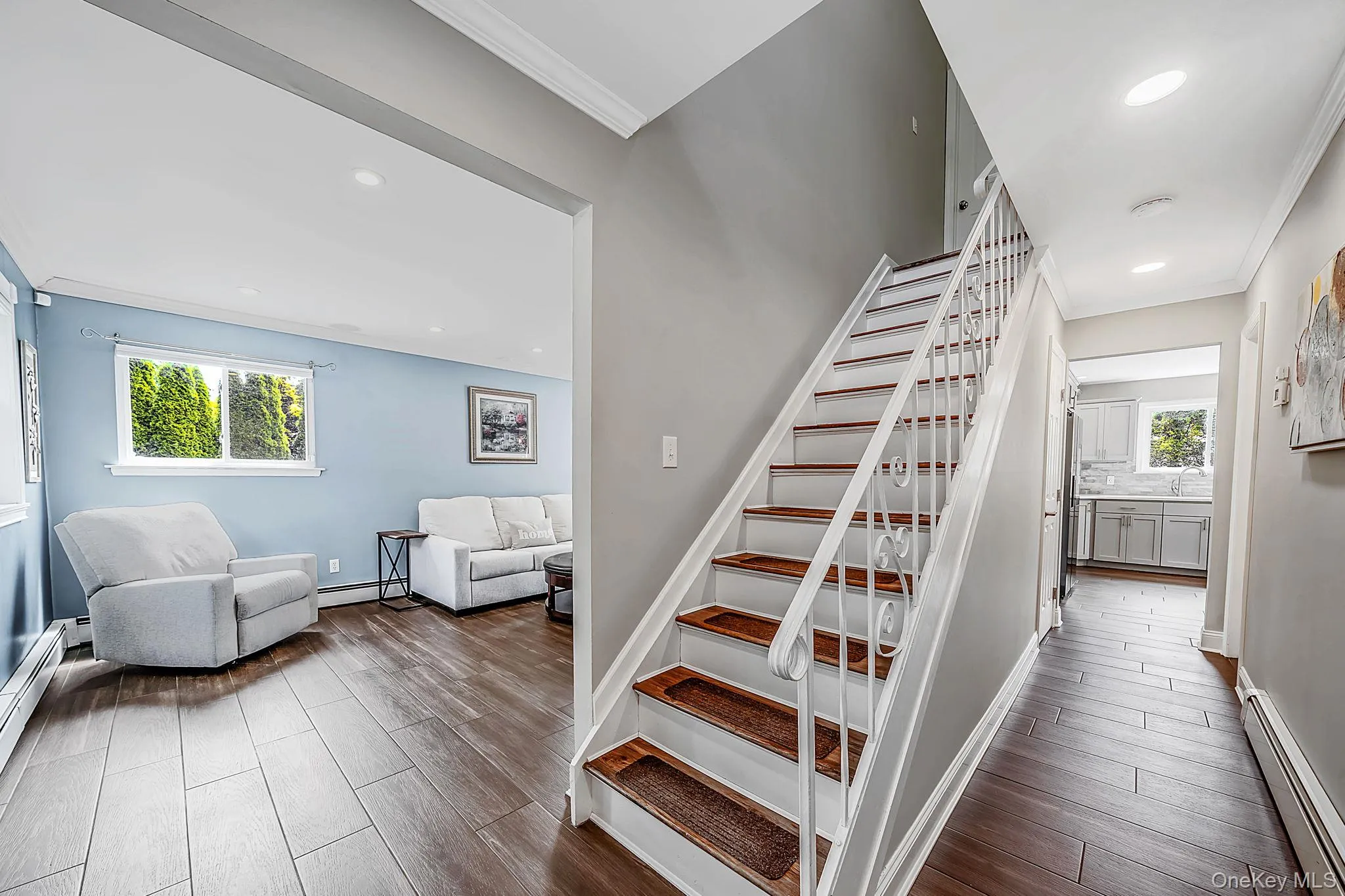 Sun drenched foyer featuring, open floorplan, porcelain tile hard wood finish flooring throughout. Sun drenched foyer featuring, open floorplan, porcelain tile hard wood finish flooring throughout.