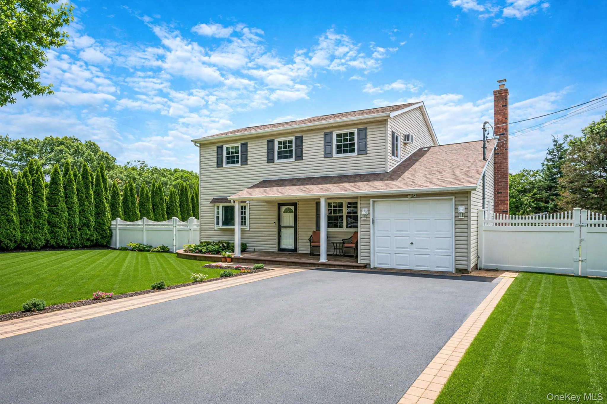 Oversized driveway w/Cambridge pavers. PVC private fencing with double gate access Oversized driveway w/Cambridge pavers. PVC private fencing with double gate access