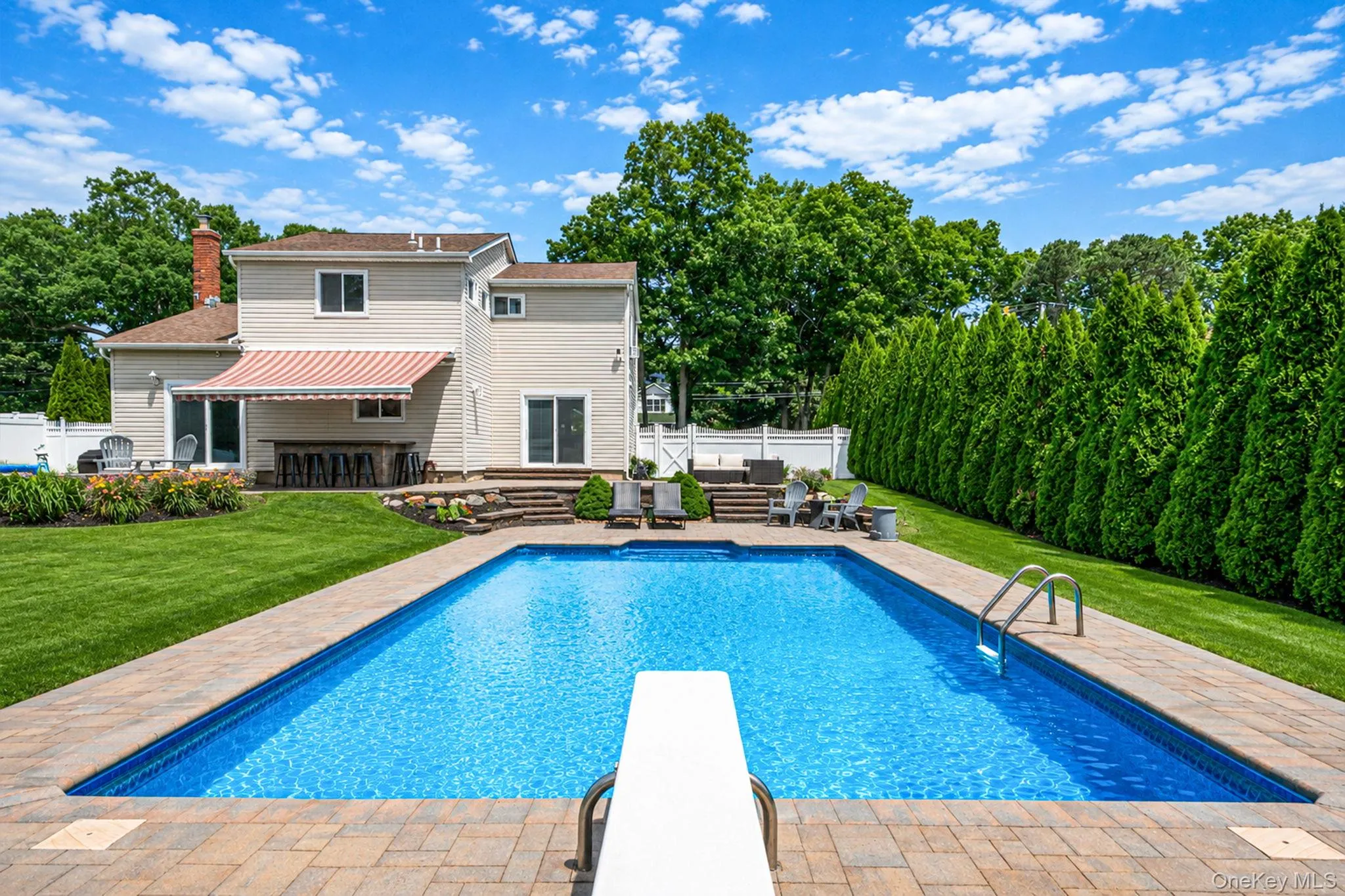 Stone Bar with granite countertop, retractable sun awning, brick fire-pit, Amazing private oasis with gorgeous 18 x 36 in-ground pool with solar cover Stone Bar with granite countertop, retractable sun awning, brick fire-pit, Amazing private oasis with gorgeous 18 x 36 in-ground pool with solar cover