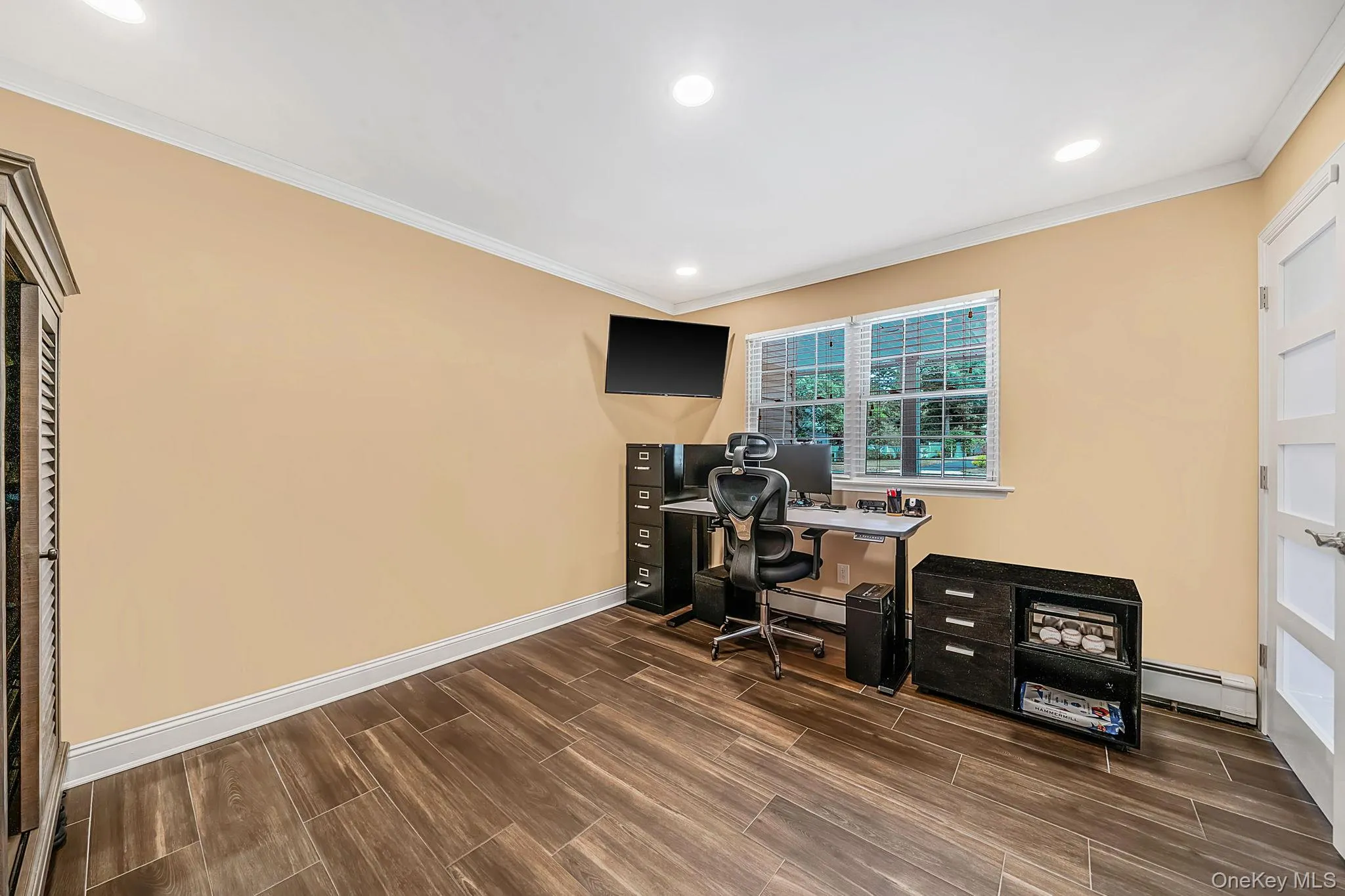 Bedroom/home office or gym located on the main floor. Crown molding and recessed lighting Bedroom/home office or gym located on the main floor. Crown molding and recessed lighting